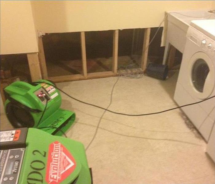 SERVPRO equipment drying up the floor flood cuts in drywall