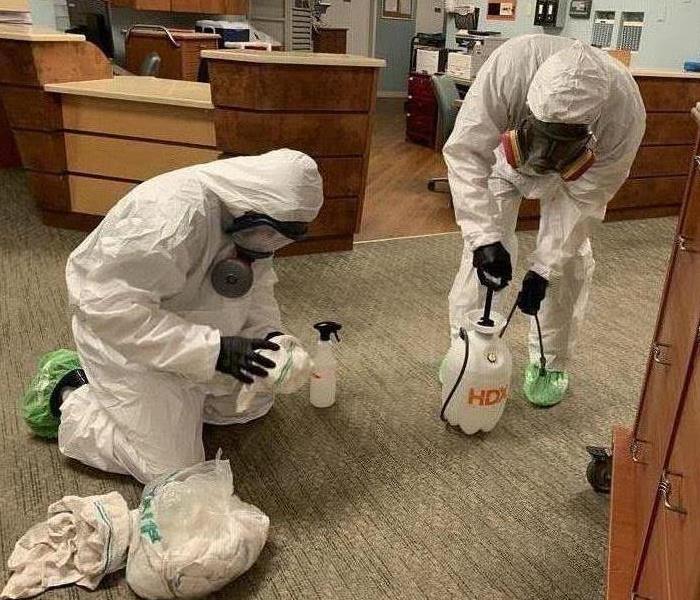 Two SERVPRO employees in an office. 
