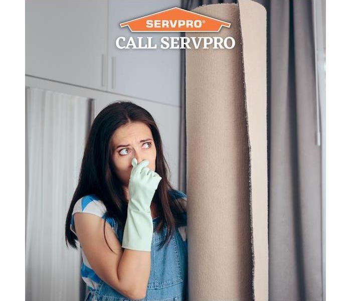 "Call SERVPRO" - woman smelling something bad