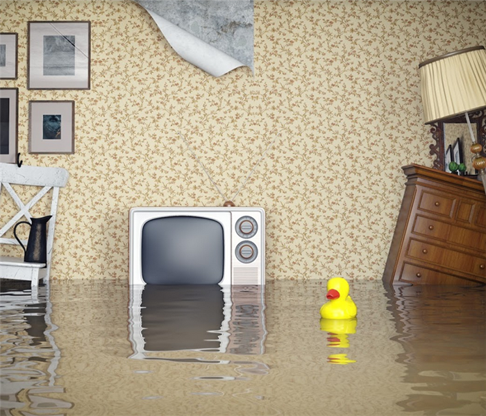 flooded living room with furniture floating