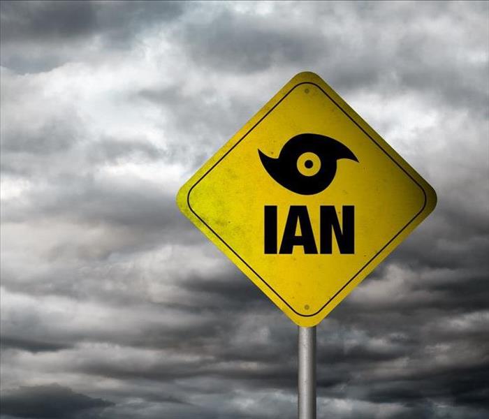 Hurricane Ian sign with clouds